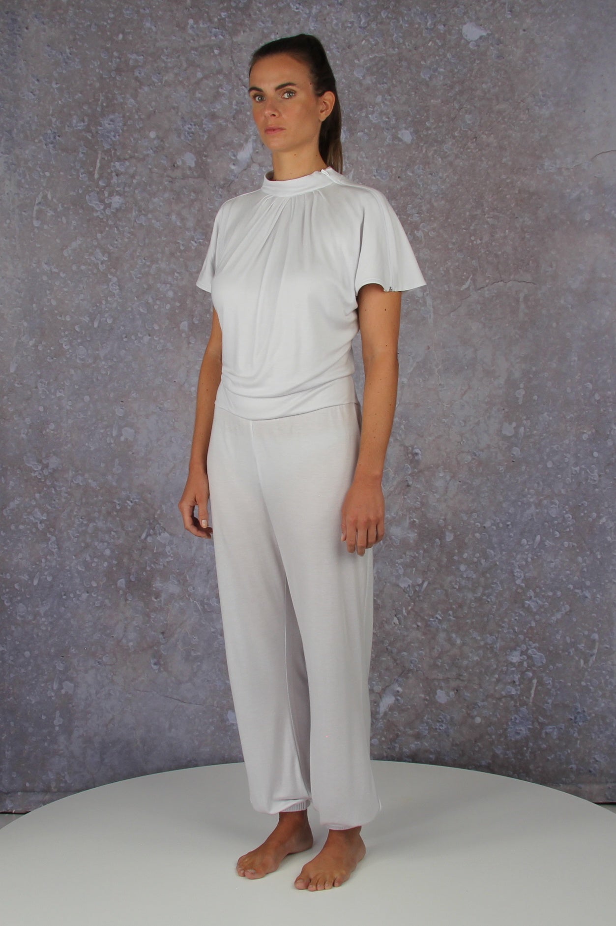 Unique model with a charming sleeve solution and stand-up collar