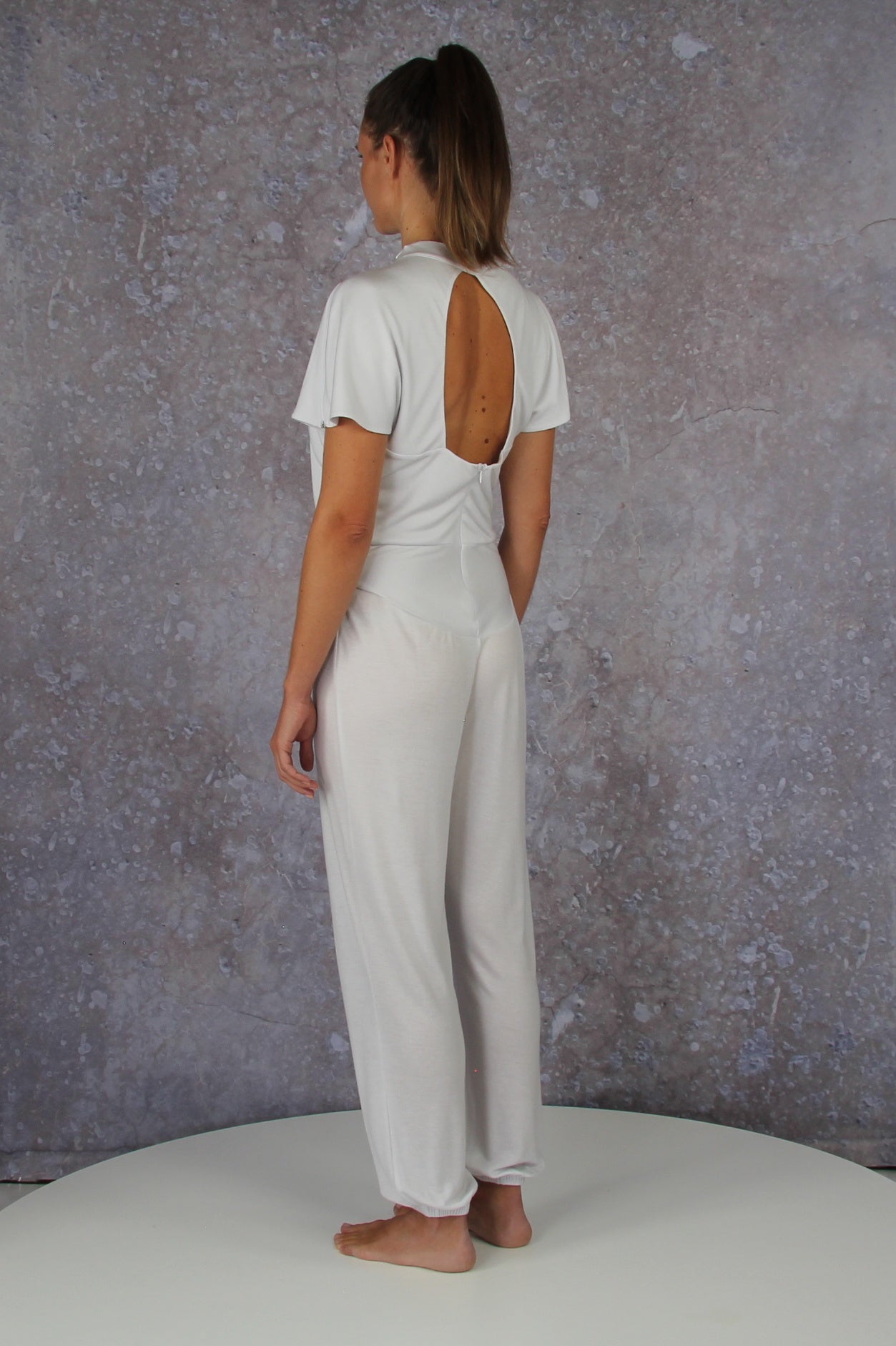 Unique model with a charming sleeve solution and stand-up collar