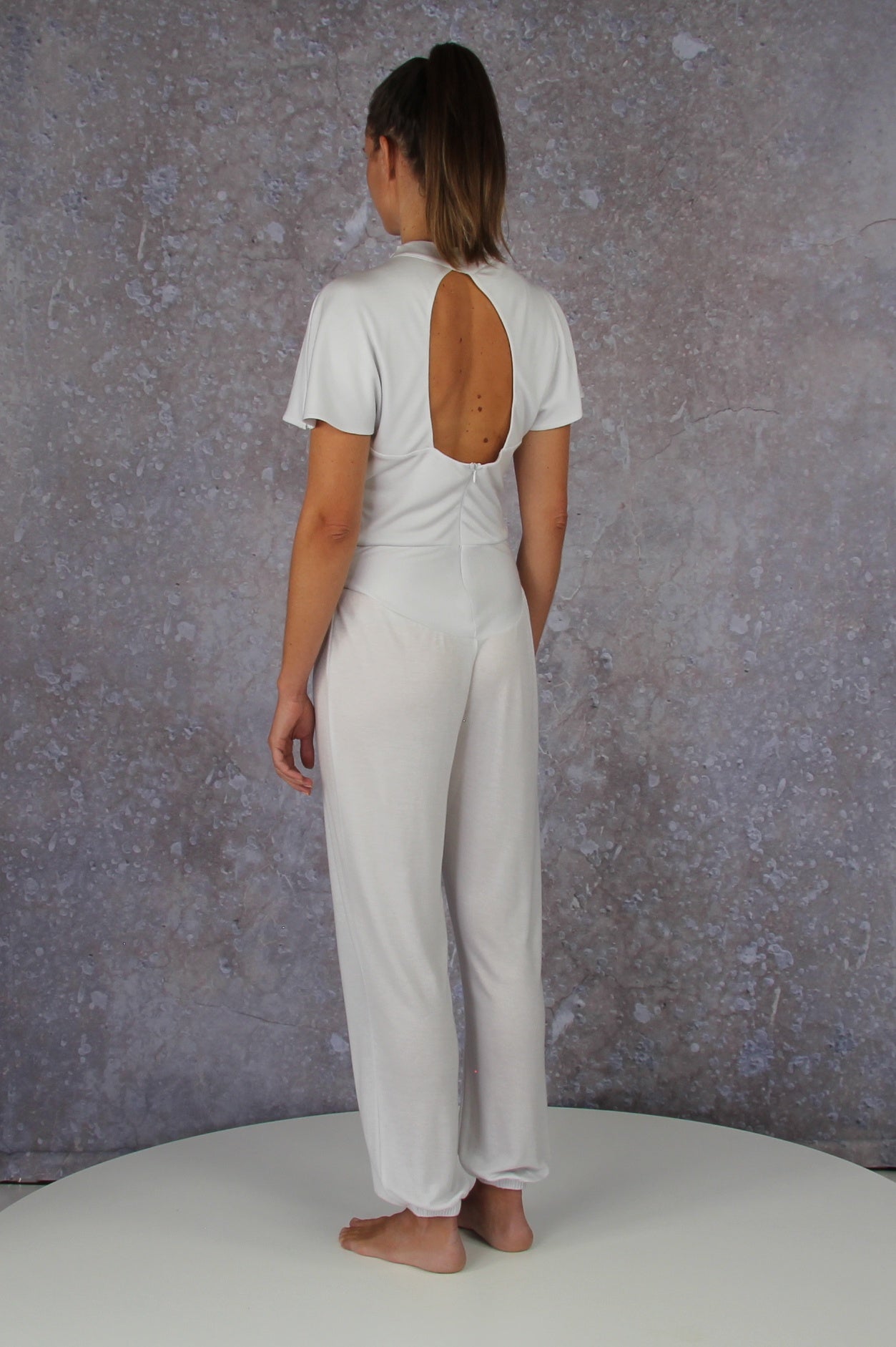 Unique model with a charming sleeve solution and stand-up collar